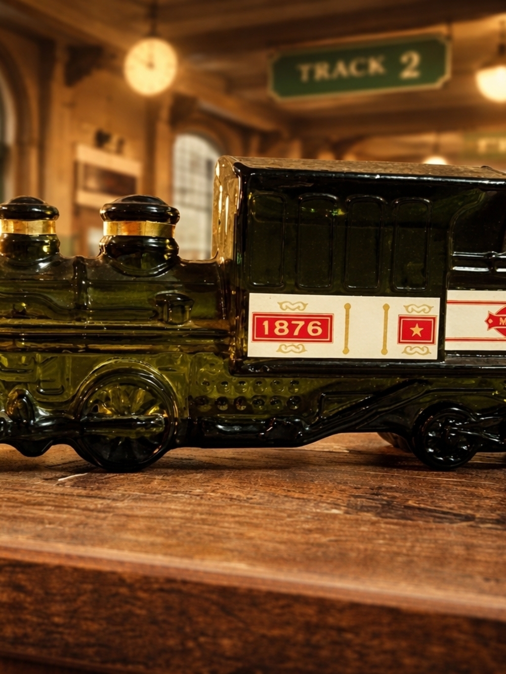 Green Glass Train Bottle with 1876 Label